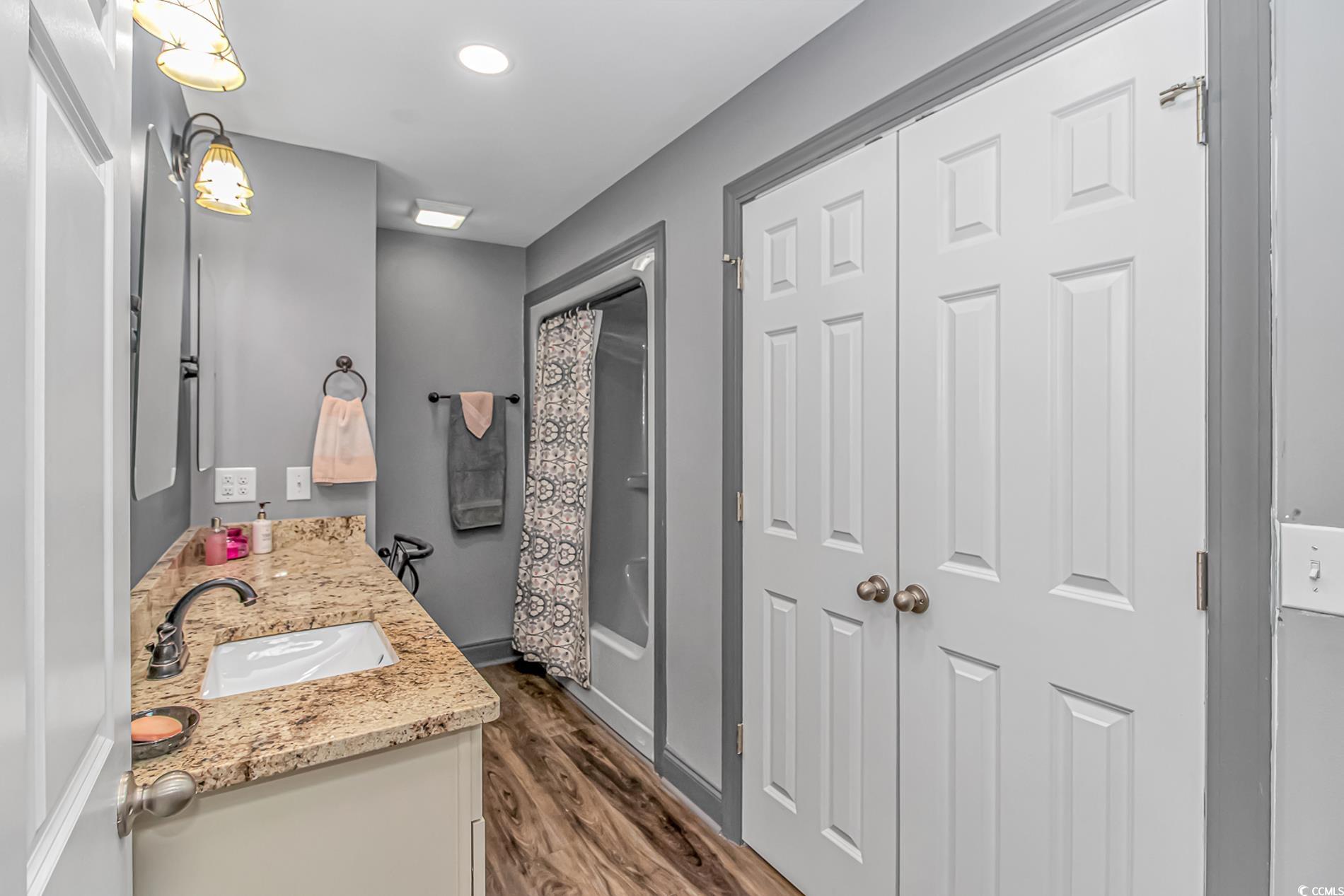 4106 Edwards Road Aynor, SC 29511 - Photo 17 of 39 Bathroom with hardwood / wood-style floors, vanity