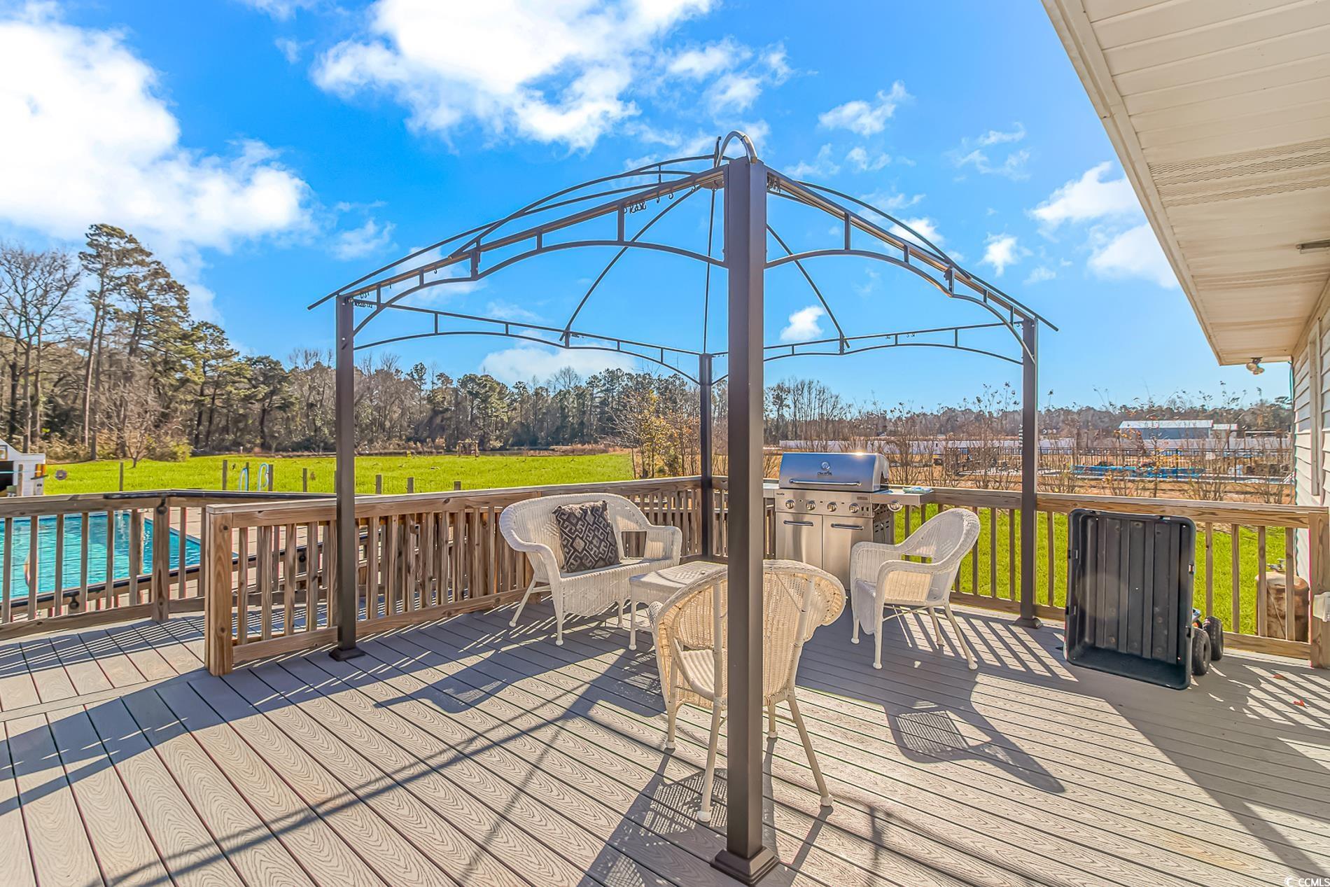 4106 Edwards Road Aynor, SC 29511 - Photo 25 of 39 Wooden terrace featuring a yard