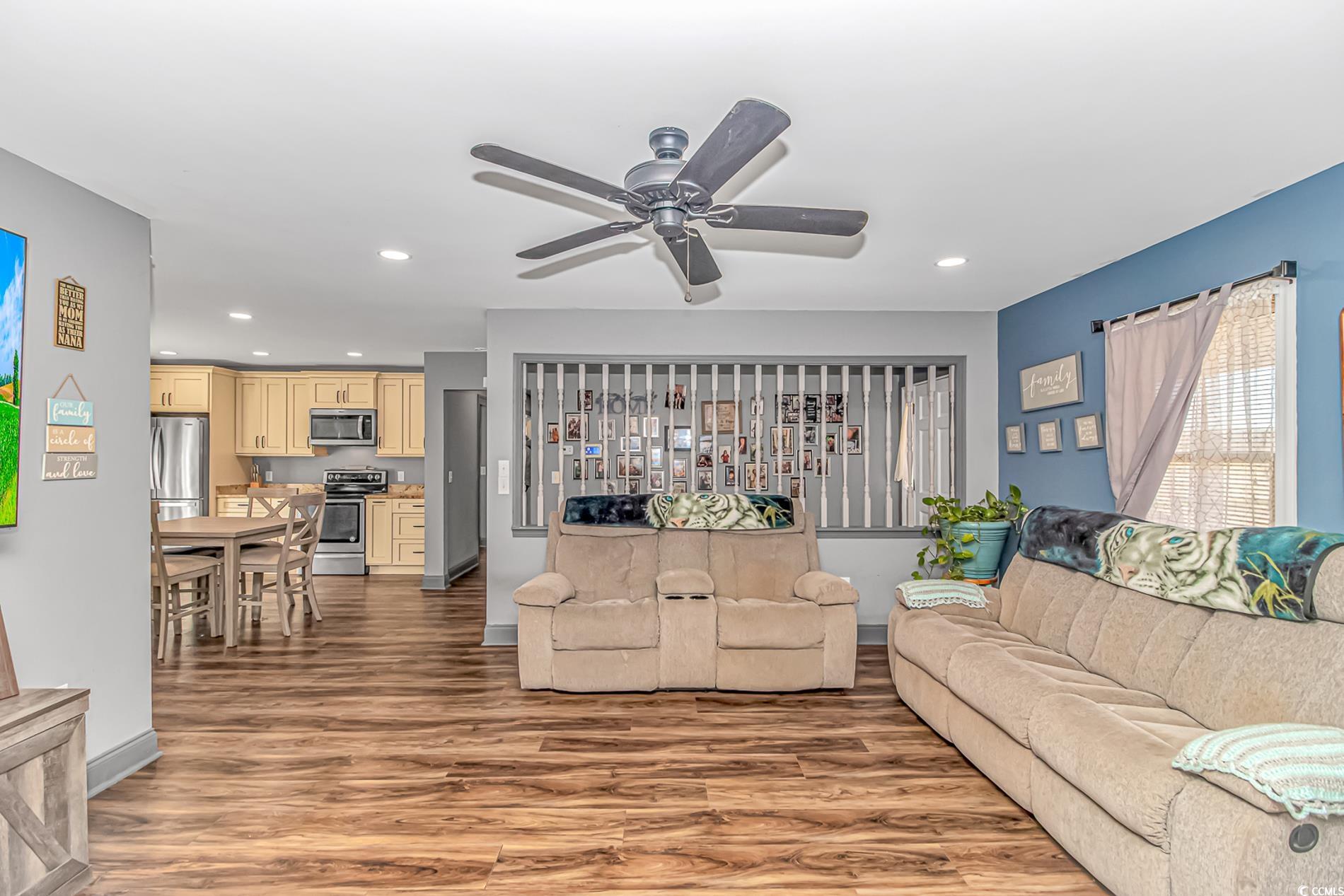 4106 Edwards Road Aynor, SC 29511 - Photo 7 of 39 Living room featuring ceiling fan and hardwood / w