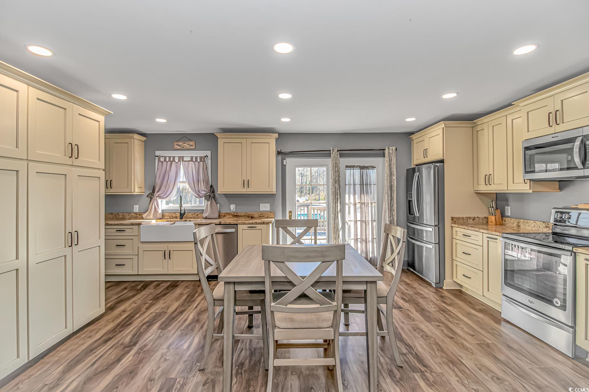 4106 Edwards Road Aynor, SC 29511 - Photo 9 of 39 Kitchen with cream cabinetry, sink, stainless stee