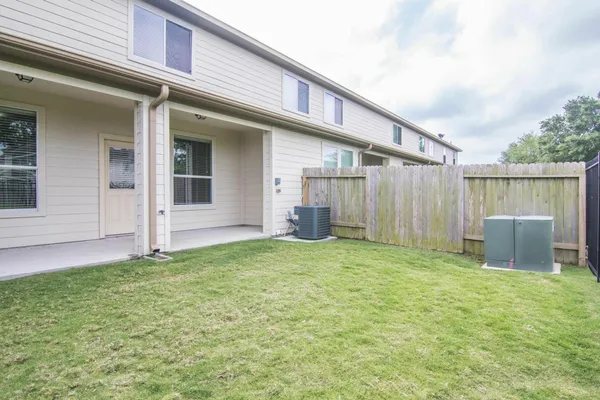 a view of a house with a yard and garage