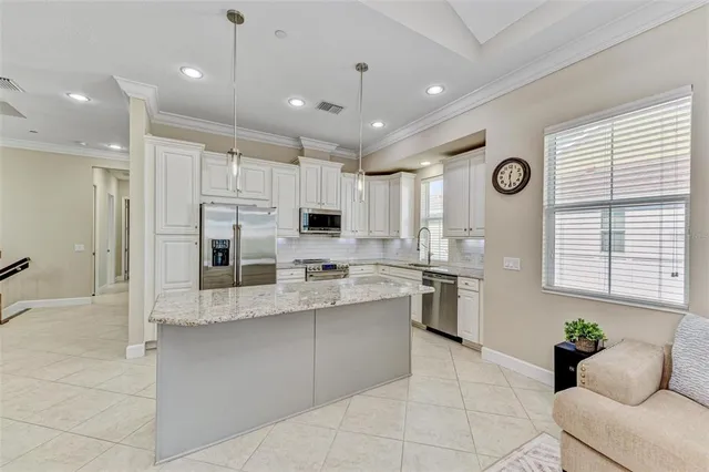 a view of swimming pool with a table and chairs
