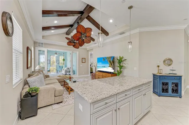 a living room with lots of furniture and hard wood flooring