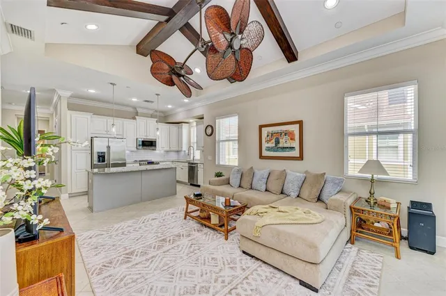a view of a patio with a table and chairs under an umbrella