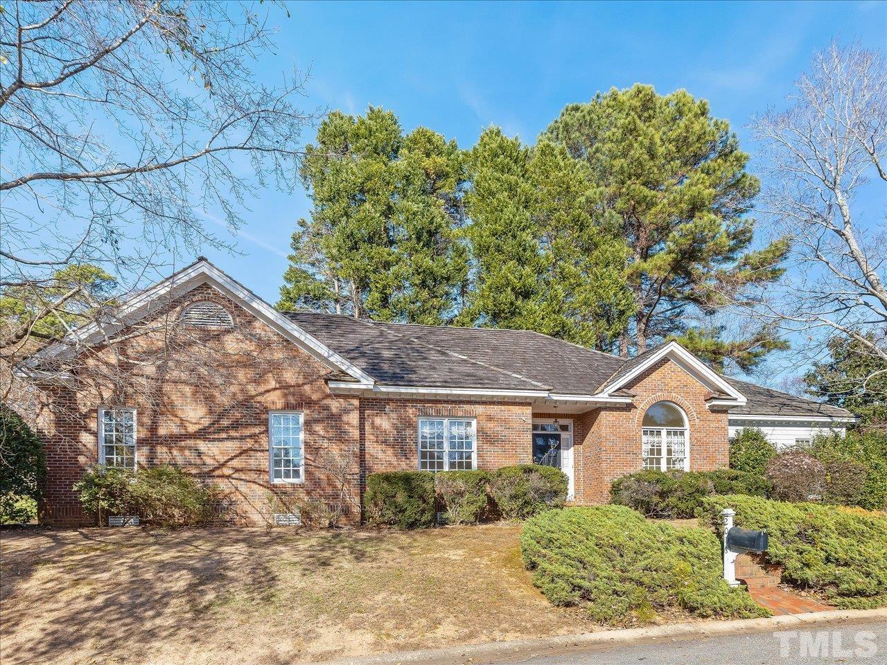 2016 Carrbridge Way Raleigh, NC 27615 - Photo 2 of 53 a front view of a house with a yard and garage