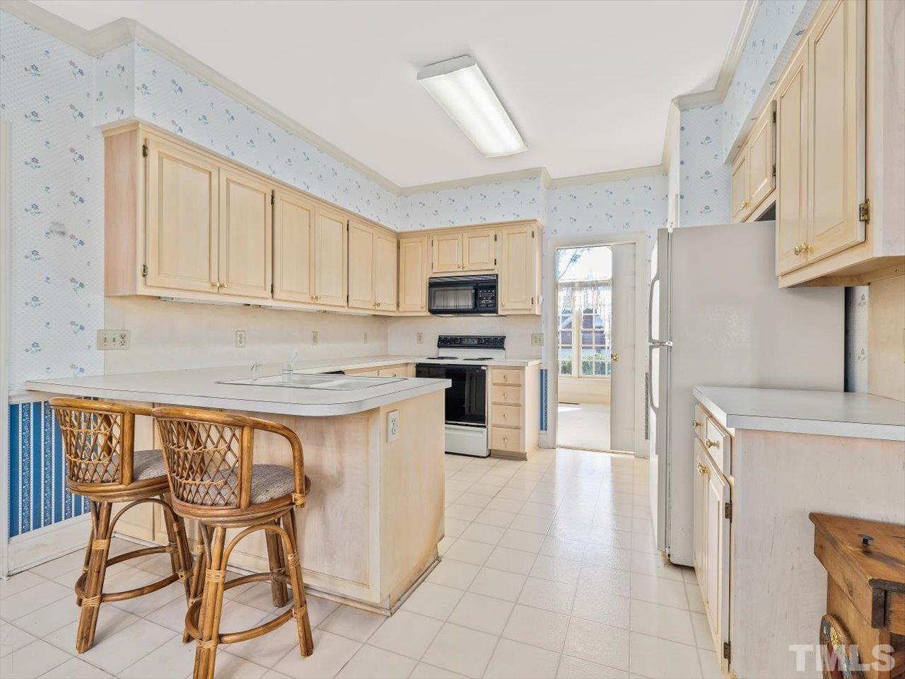 2016 Carrbridge Way Raleigh, NC 27615 - Photo 17 of 53 a kitchen with stainless steel appliances granite countertop a stove a sink dishwasher and a refrigerator