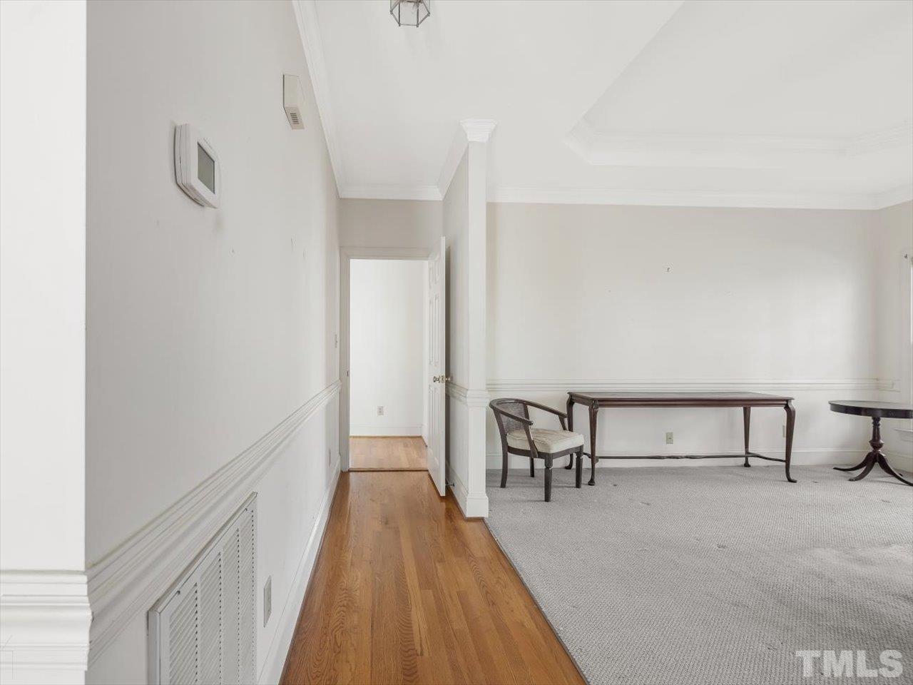 2016 Carrbridge Way Raleigh, NC 27615 - Photo 21 of 53 a view of a room with wooden floor and furniture