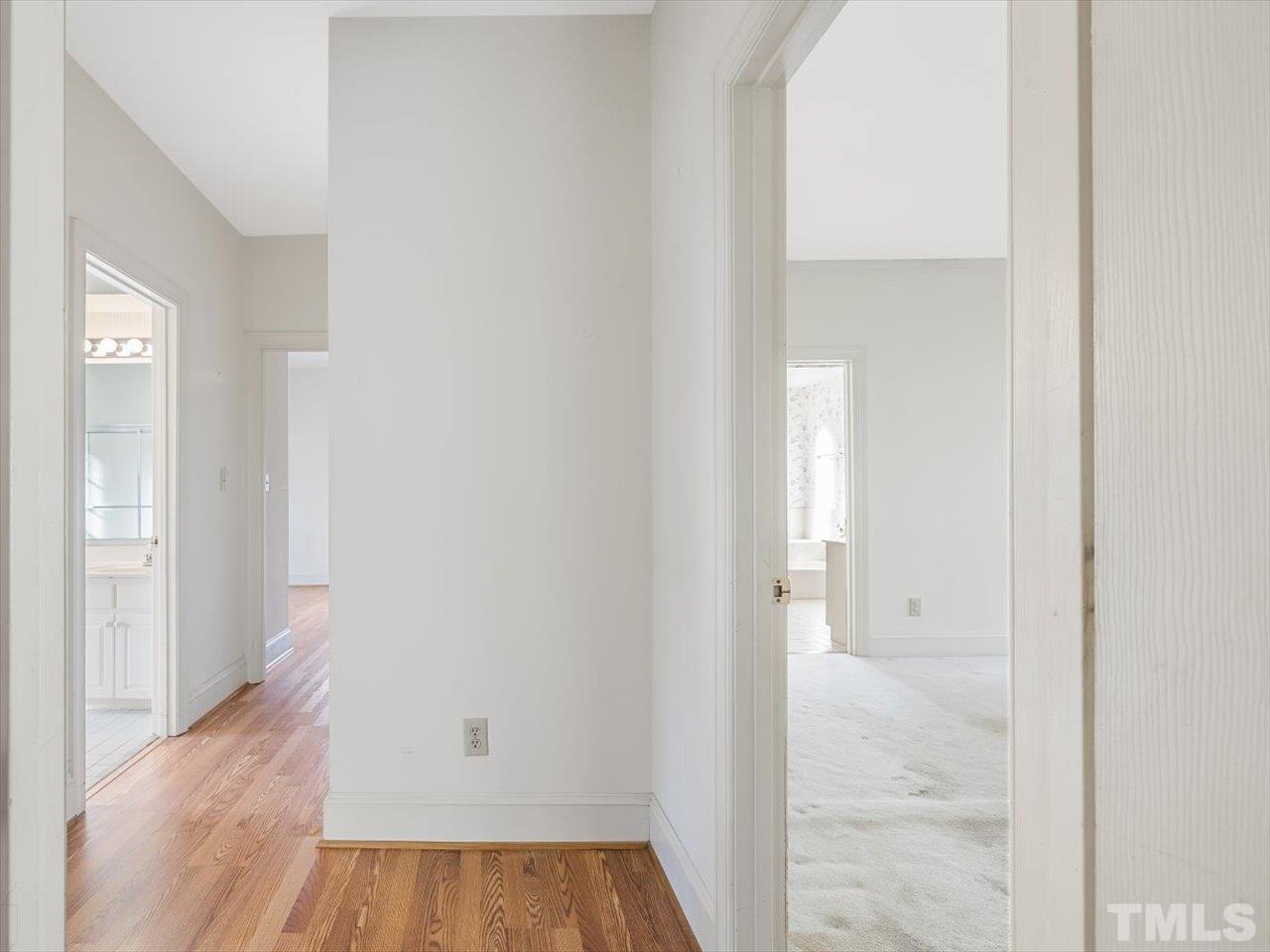 2016 Carrbridge Way Raleigh, NC 27615 - Photo 22 of 53 a view of a room with wooden floor and a bathroom