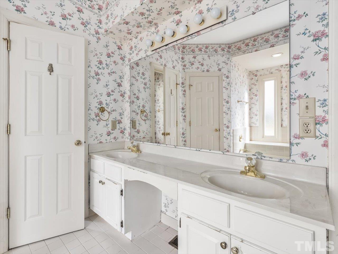 2016 Carrbridge Way Raleigh, NC 27615 - Photo 26 of 53 a bathroom with a sink and a mirror