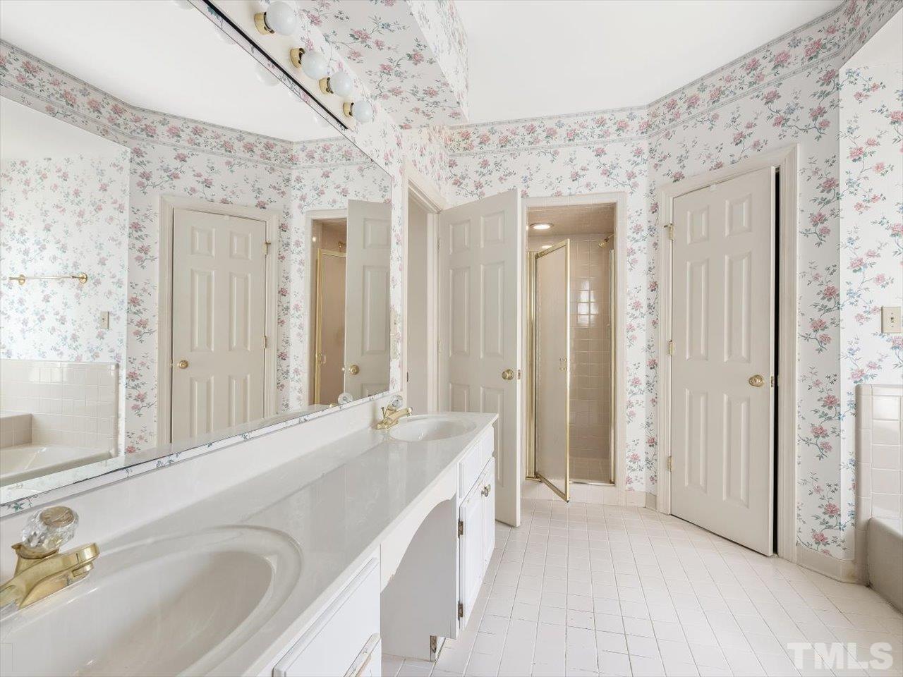 2016 Carrbridge Way Raleigh, NC 27615 - Photo 31 of 53 a spacious bathroom with a tub sink and mirror