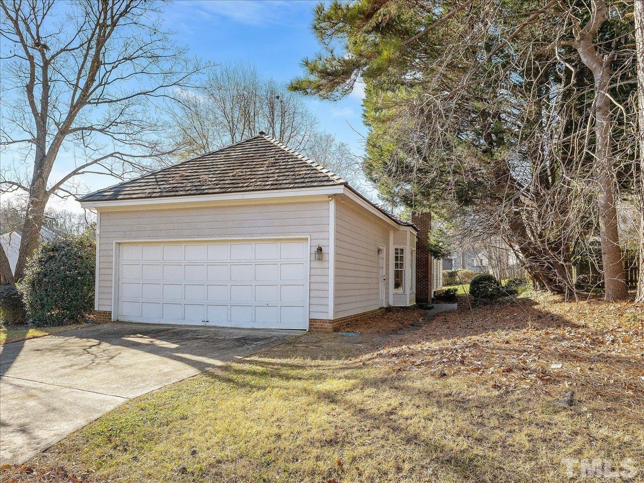 2016 Carrbridge Way Raleigh, NC 27615 - Photo 43 of 53 a view of a house with a yard and garage