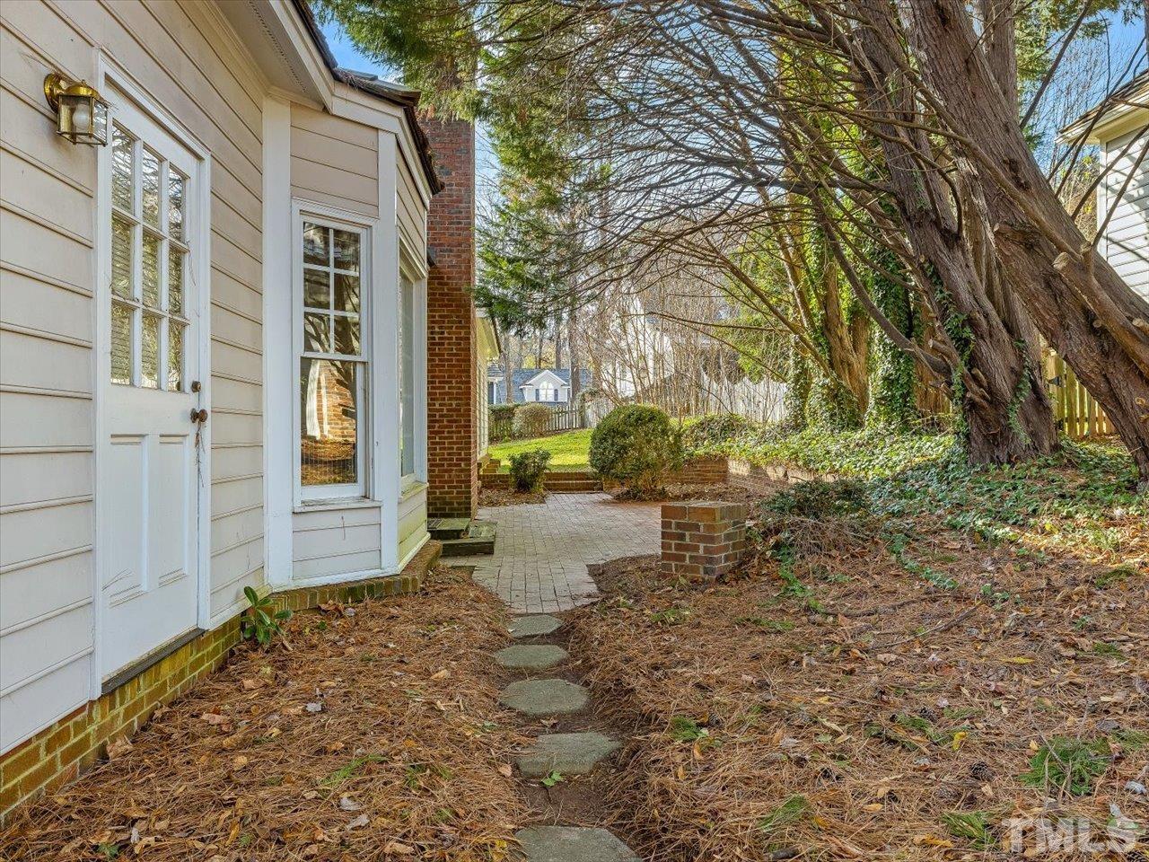 2016 Carrbridge Way Raleigh, NC 27615 - Photo 45 of 53 a view of a yard with plants and large tree