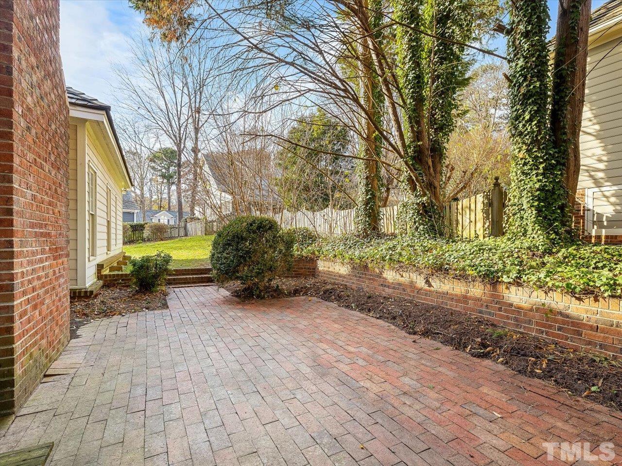 2016 Carrbridge Way Raleigh, NC 27615 - Photo 46 of 53 a view of a yard with plants and a barbeque