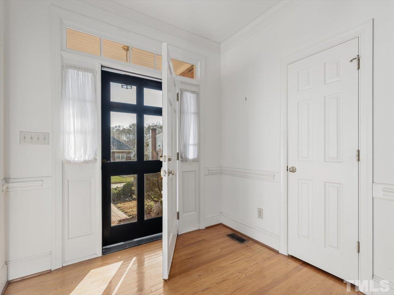 2016 Carrbridge Way Raleigh, NC 27615 - Photo 8 of 53 a view of an entryway with wooden floor
