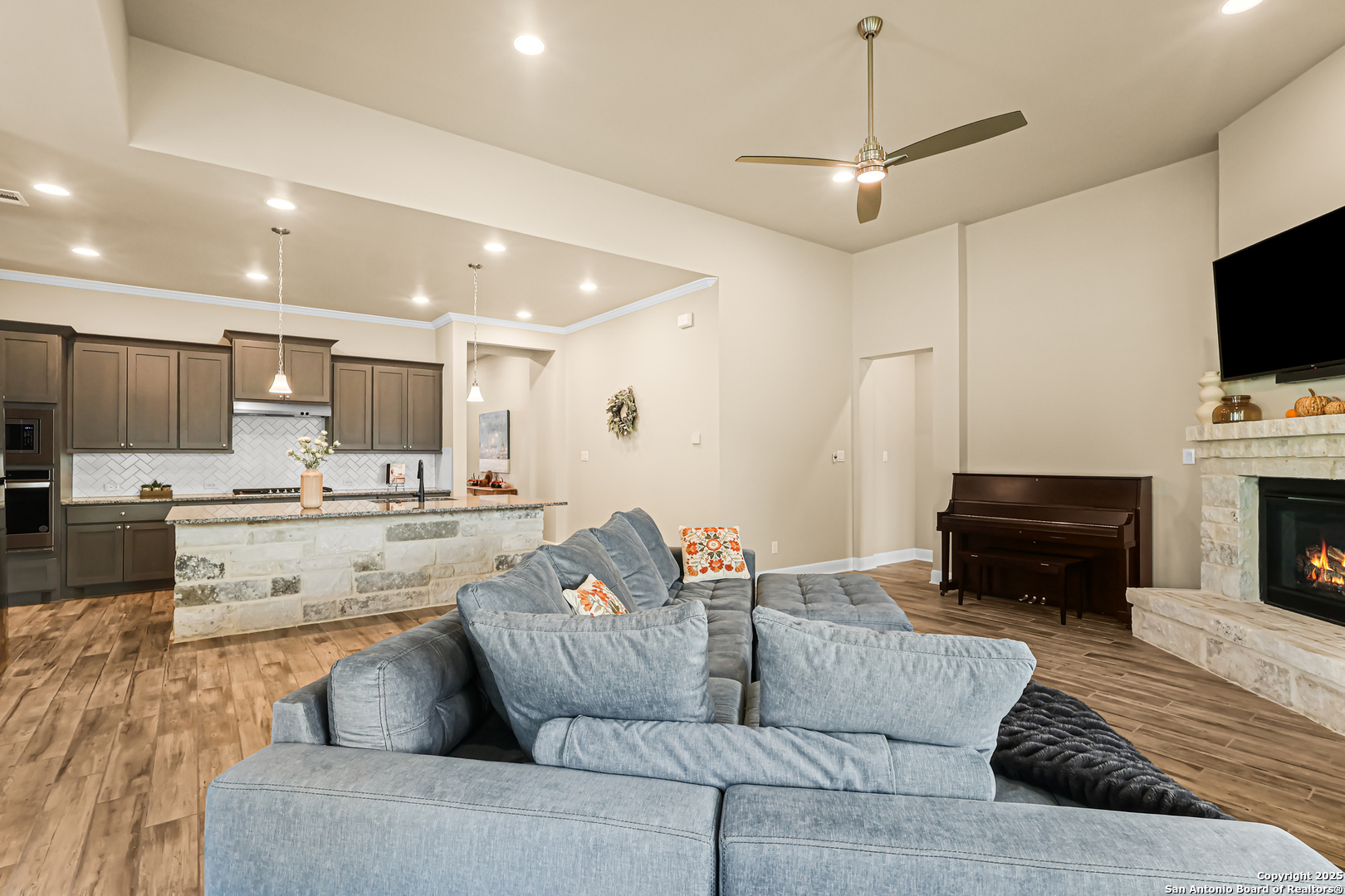 27103 Coltons Canyon San Antonio, TX 78260 - Photo 11 of 42 a living room with furniture and a flat screen tv