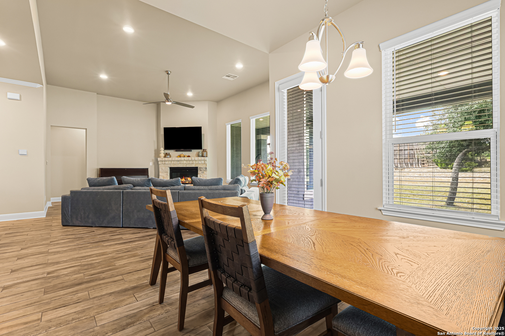 27103 Coltons Canyon San Antonio, TX 78260 - Photo 13 of 42 a view of a dining room with furniture window and wooden floor
