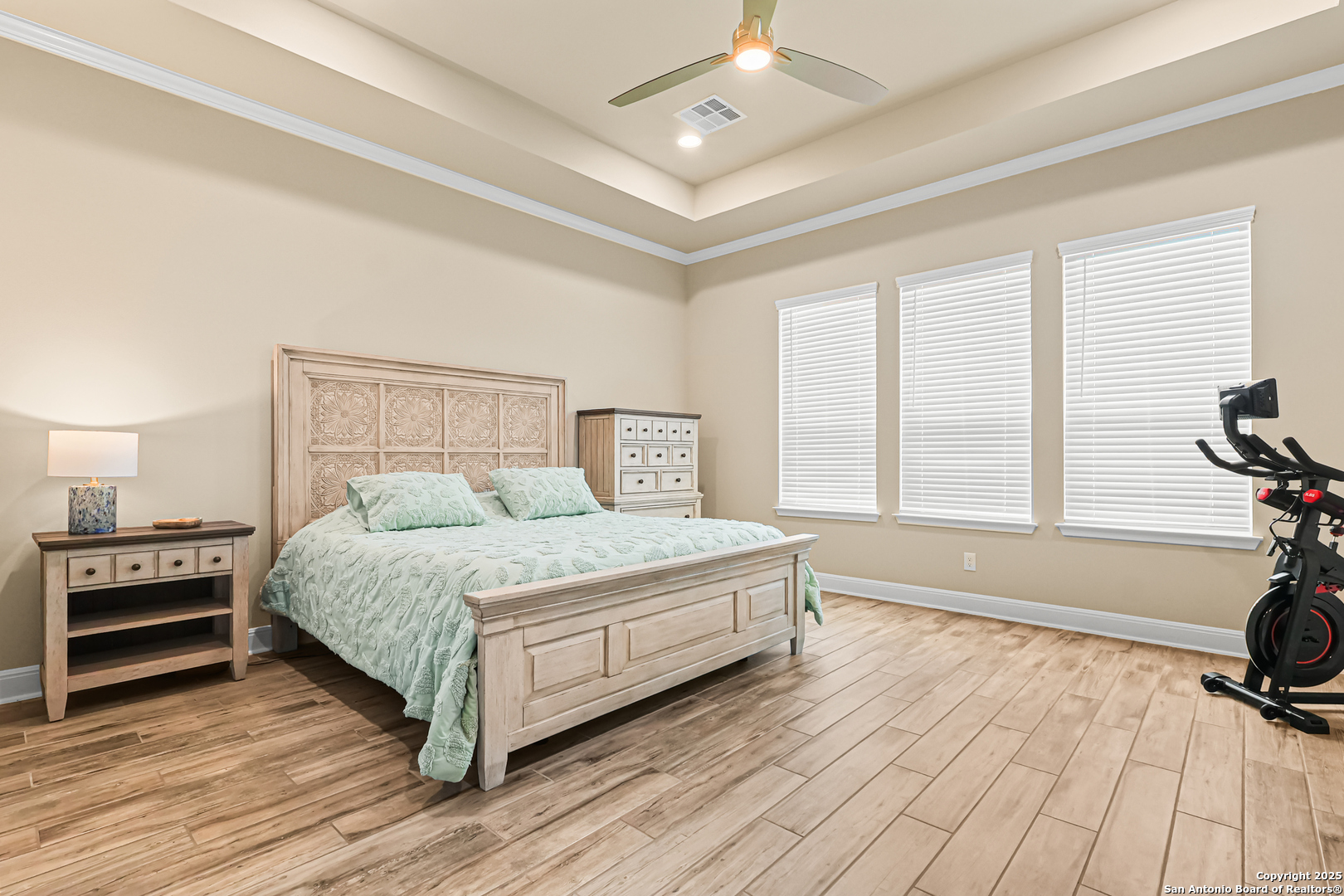 27103 Coltons Canyon San Antonio, TX 78260 - Photo 20 of 42 a bedroom with a bed and wooden floor