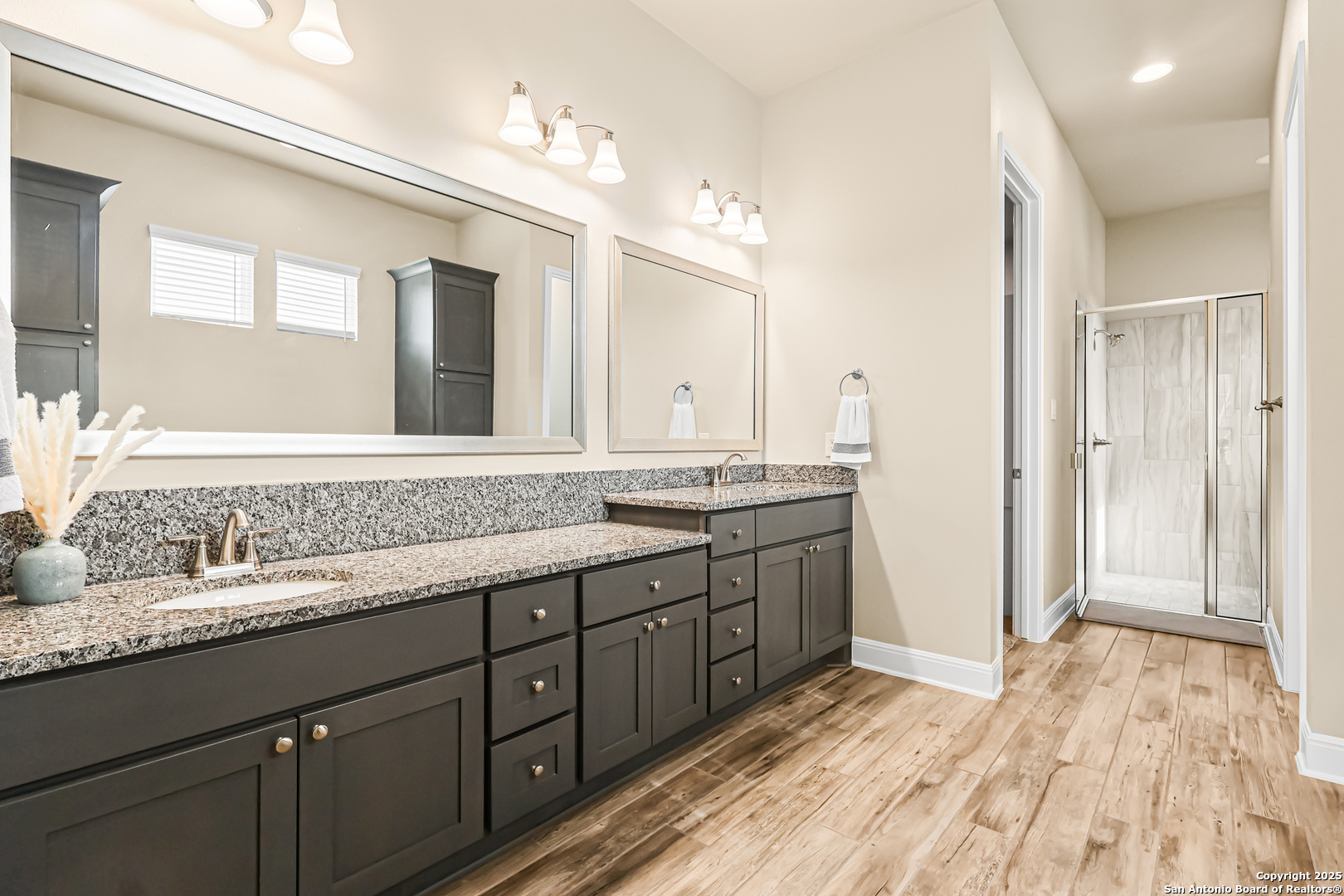 27103 Coltons Canyon San Antonio, TX 78260 - Photo 22 of 42 a bathroom with a granite countertop sink mirror and