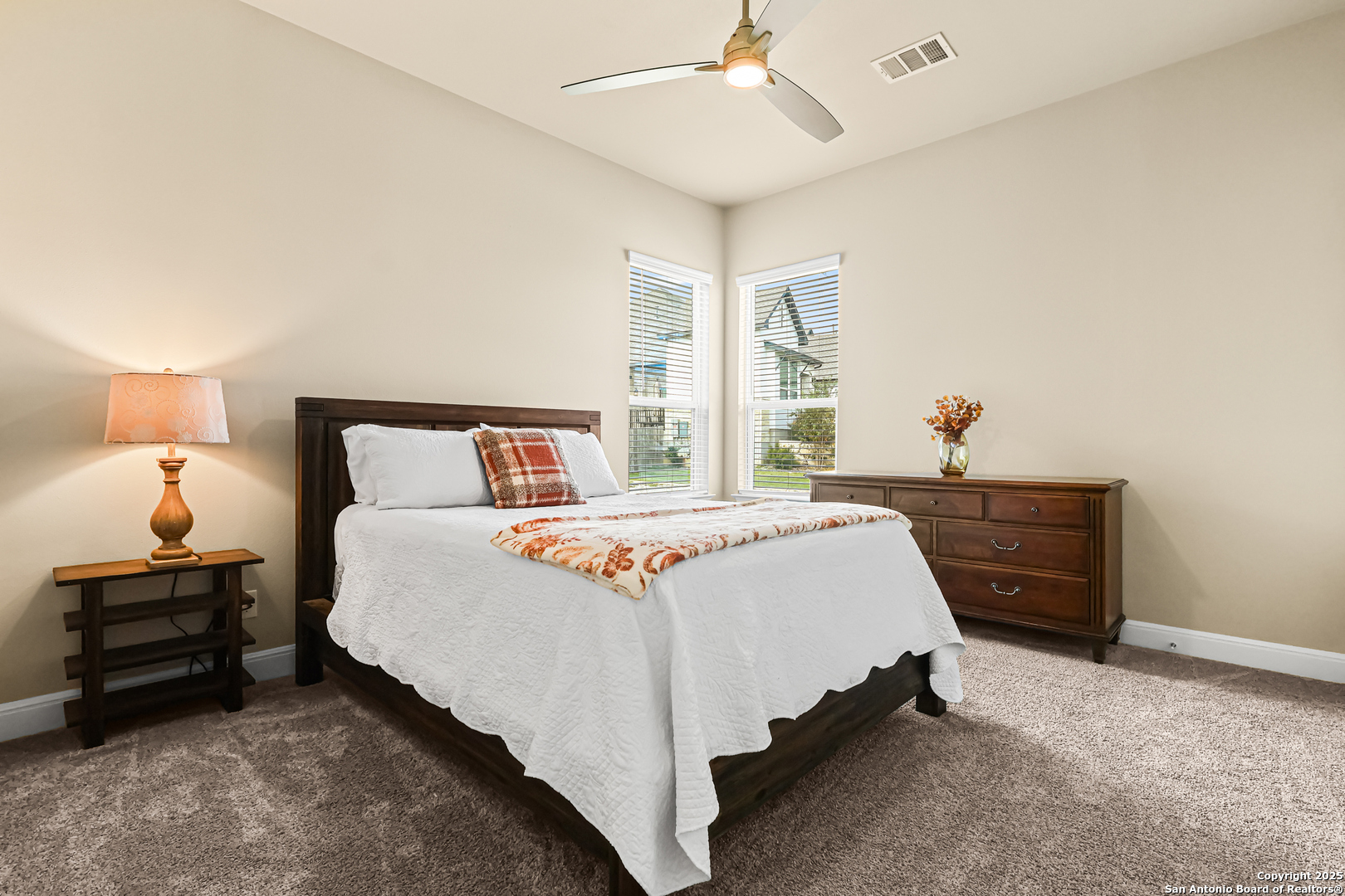 27103 Coltons Canyon San Antonio, TX 78260 - Photo 28 of 42 a bedroom with a bed and window