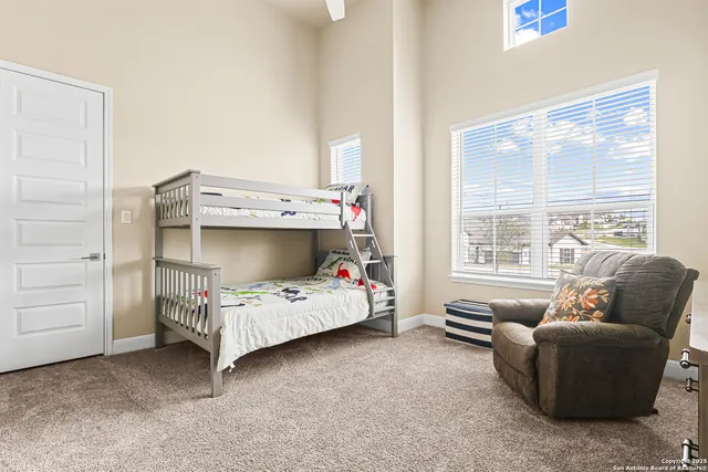 a bedroom with a bed and a couch