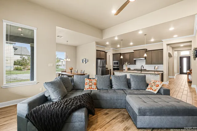 a living room with furniture and a window