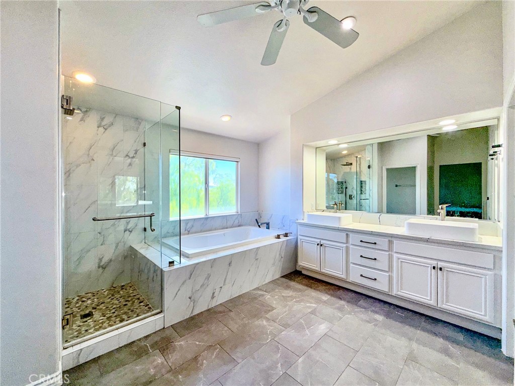 25714 Wallace Place Stevenson Ranch, CA 91381 - Photo 13 of 24 a large bathroom with a large tub and sink