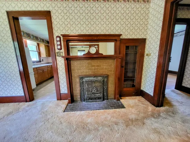 a view of livingroom with furniture and a fireplace