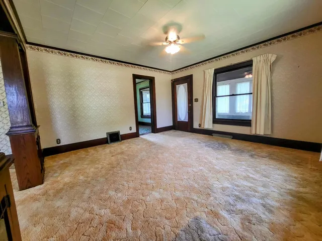 a view of an empty room with a window