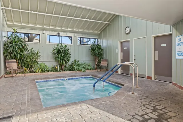 a view of a pathway with a wrought fence