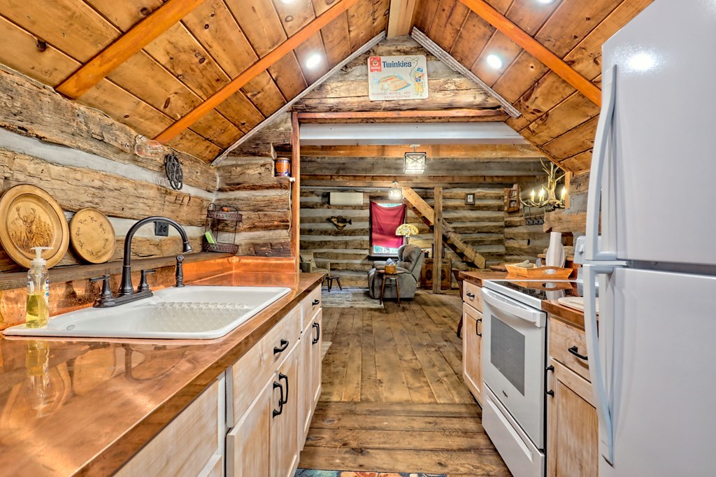 1064 Muskrat Creek Road Hayesville, NC 28904 - Photo 17 of 67 a storage room with washer and dryer