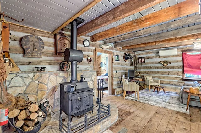 a view of a balcony with floor to ceiling windows with wooden floor