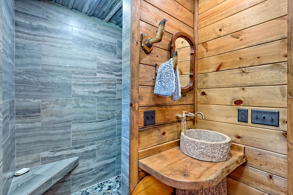 1064 Muskrat Creek Road Hayesville, NC 28904 - Photo 23 of 67 a room with a wooden floor and a potted plant