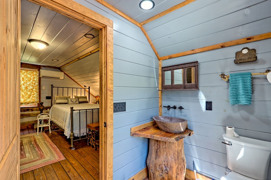 1064 Muskrat Creek Road Hayesville, NC 28904 - Photo 33 of 67 a bathroom with a sink and a mirror