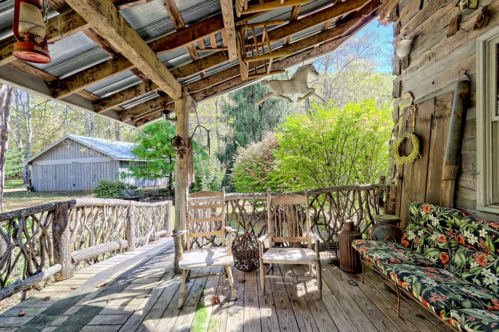 1064 Muskrat Creek Road Hayesville, NC 28904 - Photo 36 of 67 a view of balcony with wooden floor and outdoor seating
