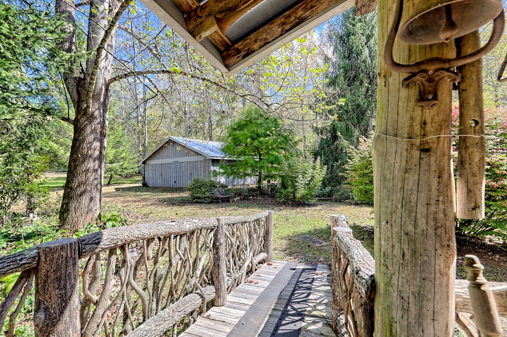 1064 Muskrat Creek Road Hayesville, NC 28904 - Photo 37 of 67 a view of a pathway of a house with wooden fence