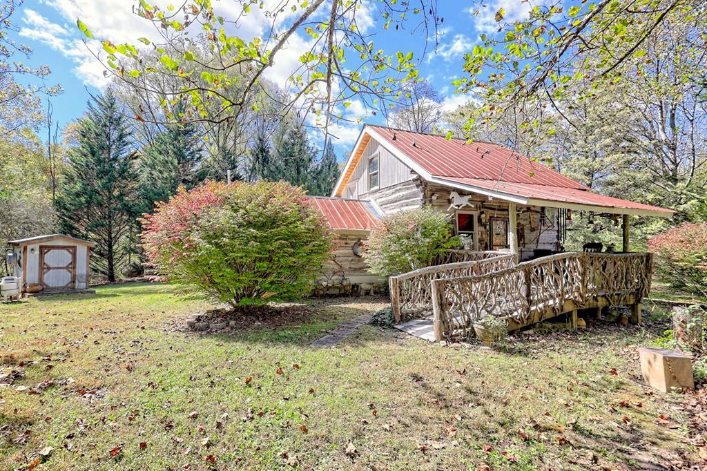 1064 Muskrat Creek Road Hayesville, NC 28904 - Photo 40 of 67 a view of a house with a yard