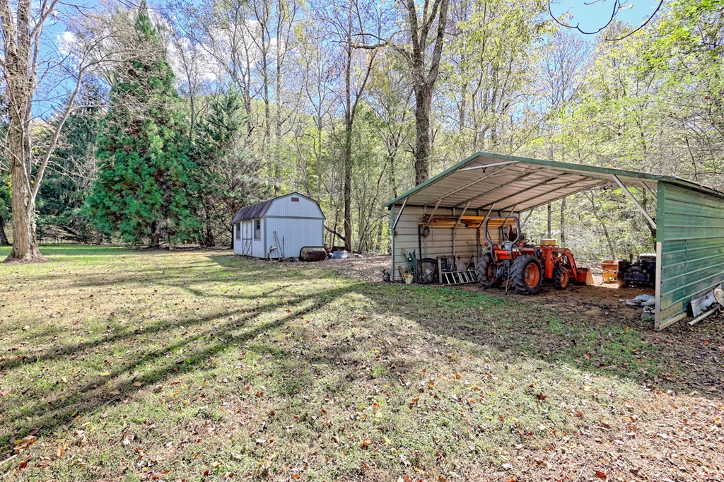 1064 Muskrat Creek Road Hayesville, NC 28904 - Photo 42 of 67 a view of a house with a yard