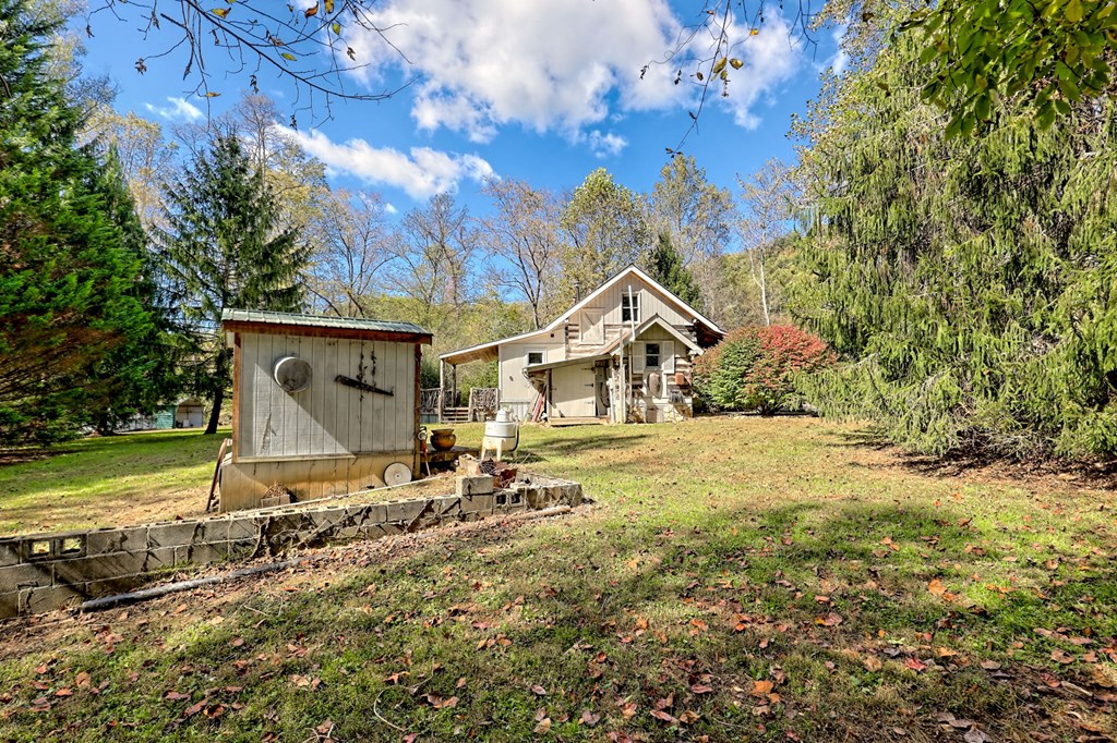 1064 Muskrat Creek Road Hayesville, NC 28904 - Photo 46 of 67 a small house with a tree in the background