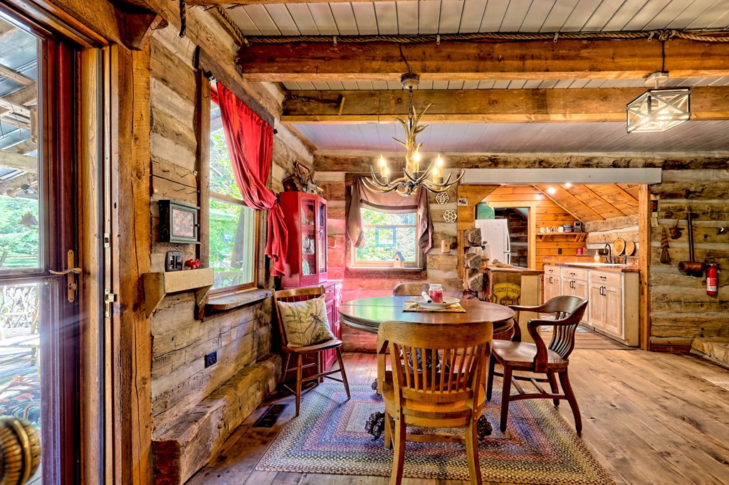 1064 Muskrat Creek Road Hayesville, NC 28904 - Photo 10 of 67 a view of a chairs and table in a balcony