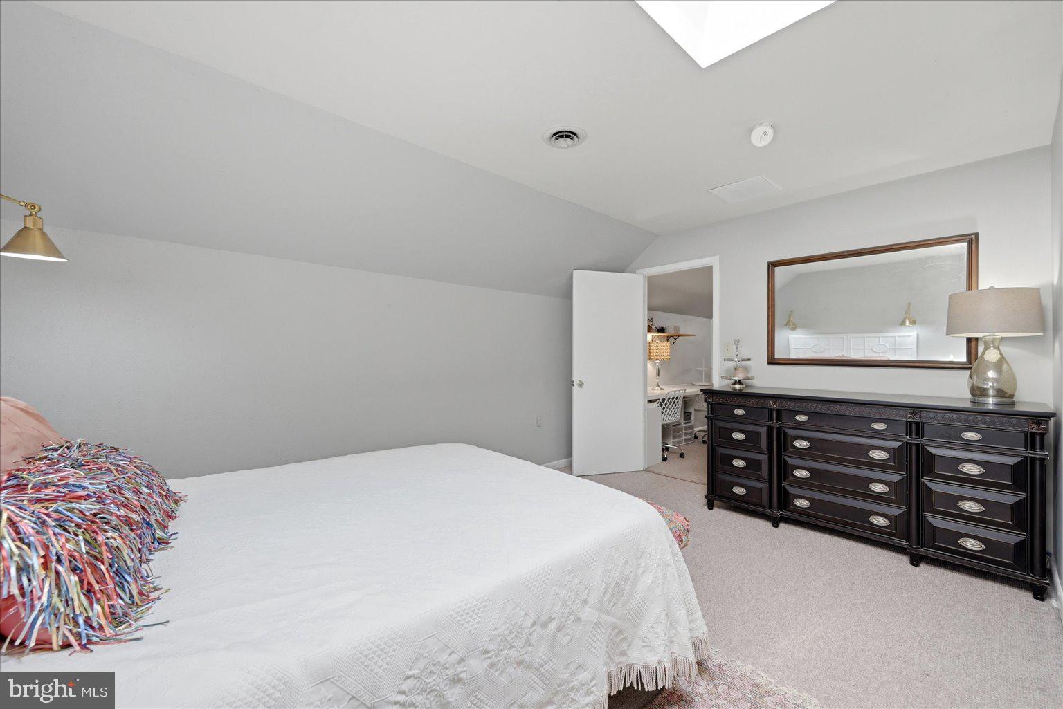 165 Wilson Burke Road Front Royal, VA 22630 - Photo 45 of 134 a bedroom with a bed and a mirror on dresser