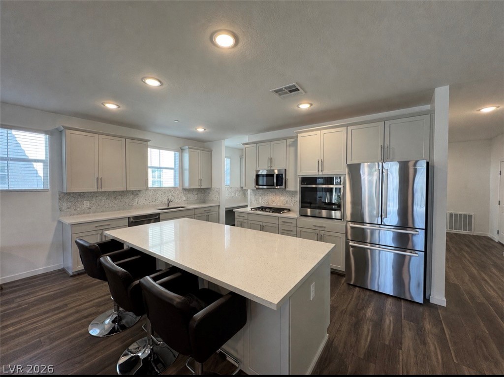 2555 Hampton Road, Unit 4205 Henderson, NV 89052 - Photo 1 of 52 This kitchen features sleek countertops, modern appliances, and a spacious island for gathering.
