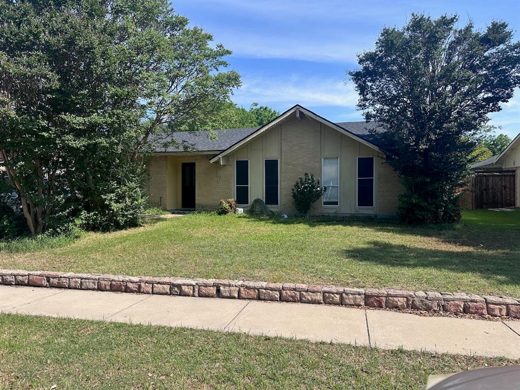 2103 Carlton Road Carrollton, TX 75007 - Photo 16 of 18 a view of a house with a yard