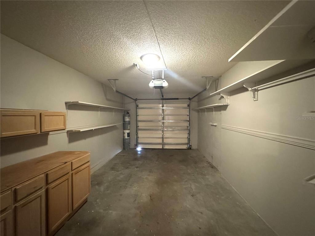 14328 Rainsong Drive Orlando, FL 32824 - Photo 26 of 27 a view of a room with storage and utility room