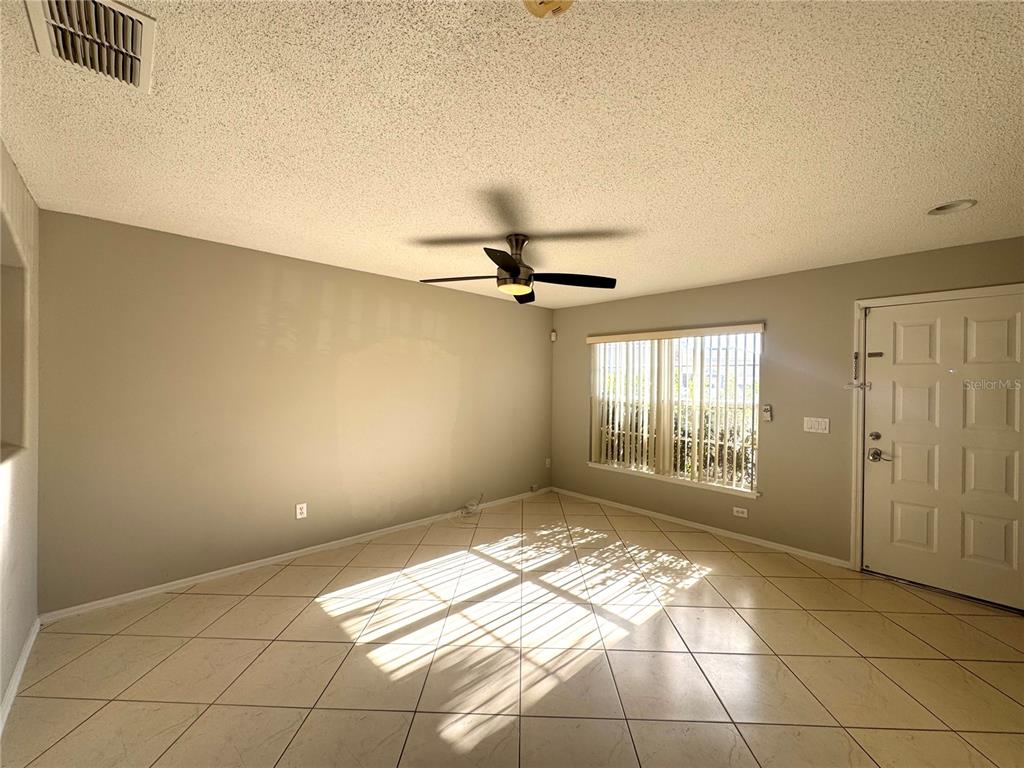 14328 Rainsong Drive Orlando, FL 32824 - Photo 5 of 27 a view of an empty room and window