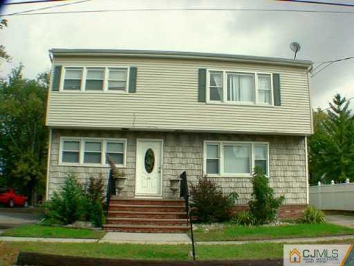 46 Amboy Road Old Bridge, NJ 07747 - Photo 3 of 3 a front view of a house with a yard