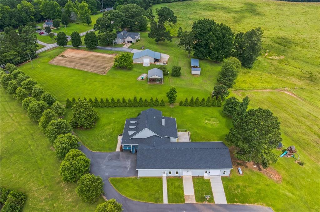 500 Coleman Mill Road Carrollton, GA 30116 - Photo 54 of 83 an aerial view of a house with a garden and swimming pool