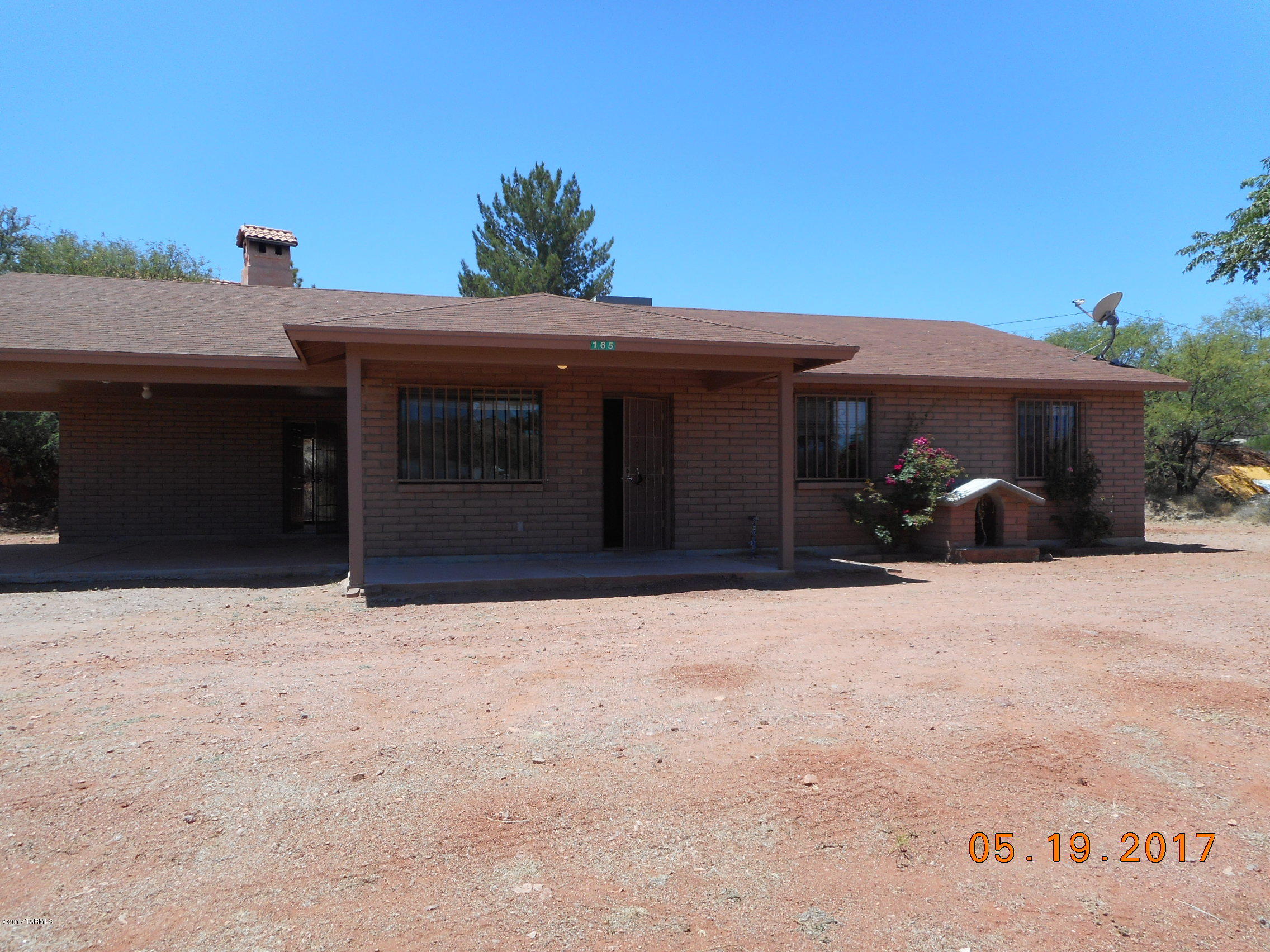 165 Entrada Court Rio Rico, AZ 85648 - Photo 2 of 33 a front view of a house with a yard
