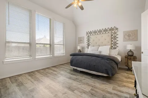 a bedroom with a bed and window