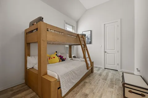 a view of a bedroom with furniture and staircase