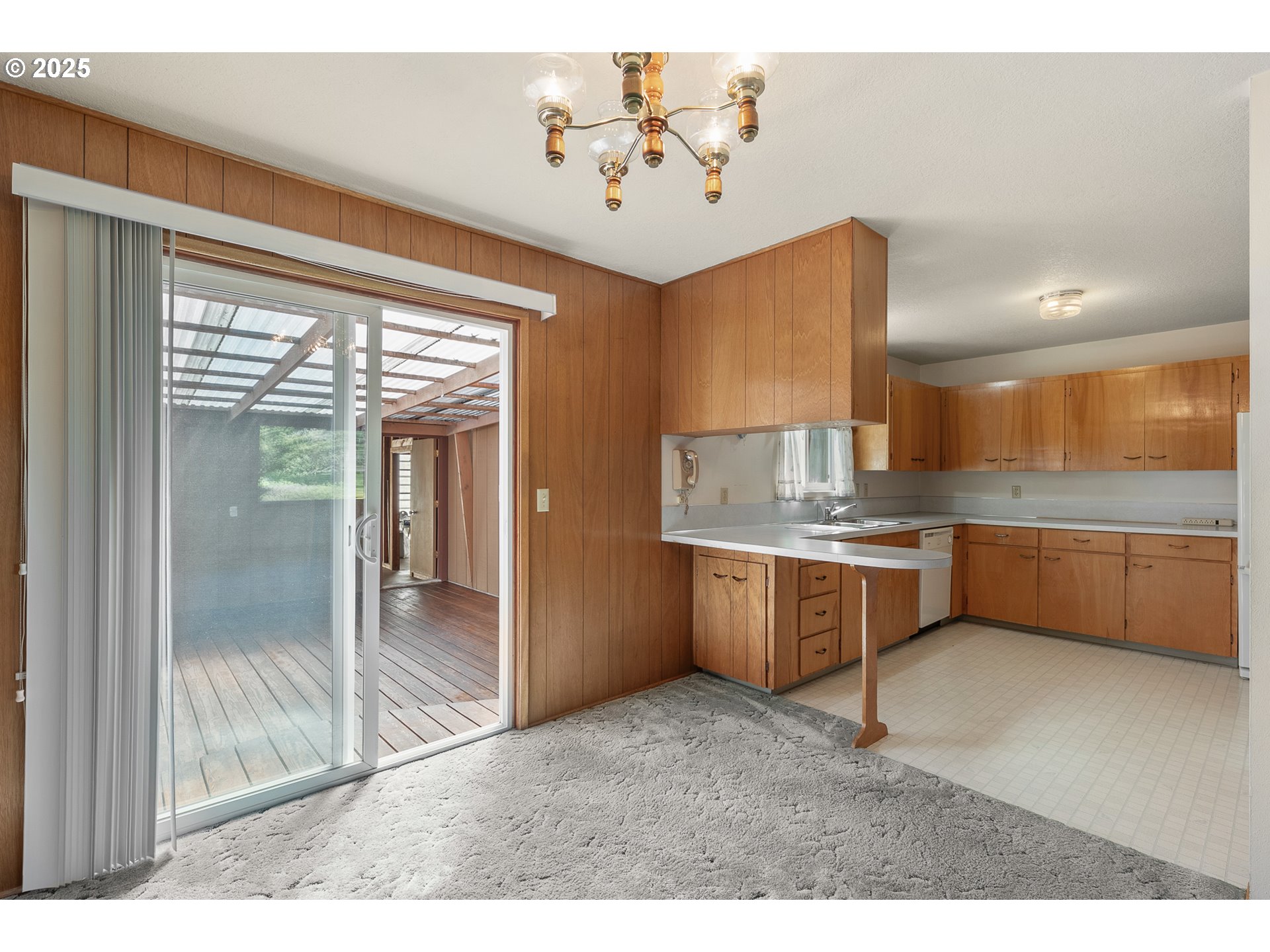 1088 Nopal Street Florence, OR 97439 - Photo 13 of 37 a kitchen with a refrigerator and a sink